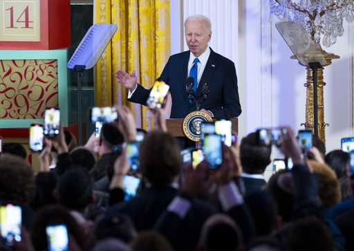 President Joe Biden speaks during a Hanukkah reception in the East Room of the White House in Washi…