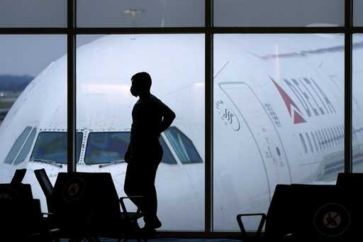 A passenger waits for a Delta Airlines flight at Hartsfield-Jackson International Airport in Atlant…
