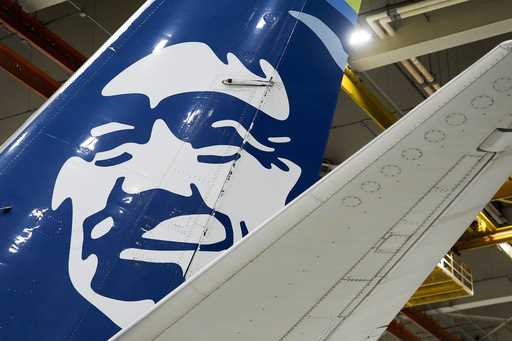 An Alaska Airlines aircraft sits in the airline's hangar at Seattle-Tacoma International Airport We…