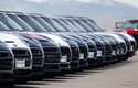 A line of unsold 2018 Cooper Clubmen sit in a long row at a Mini dealership, March 30, 2018, in Hig…