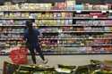 A customer buys Chinese made ginger candy at 99 Ranch Market, an Asian grocery store in Los Angeles…