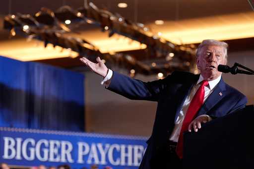 President Donald Trump gestures to a chart as he speaks at Mount Airy Casino Resort, December 9, 20…