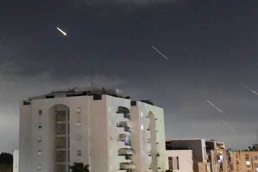 Israeli Iron Dome air defense system launches to intercept missiles fired from Iran, in central Isr…