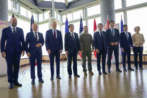 President Joe Biden, third left, and Ukrainian President Volodymyr Zelenskyy, center, and other G7 …
