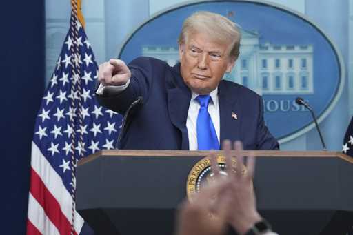 President Donald Trump points to a reporter to take a question as he speaks to the media, Friday, J…