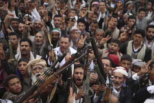Houthi supporters shout slogans during a weekly, anti-U