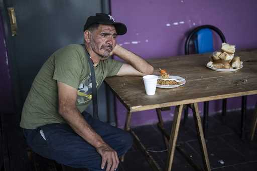 Vicente Bustamante rests after eating lunch at the Casa Comunitaria del Fondo soup kitchen in the P…