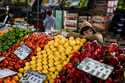 A vendor waits for customers at the central market for fruit and vegetables in Buenos Aires, Argent…