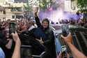 Argentine President Javier Milei waves to supporters upon arriving at a hotel in Rosario, Argentina…