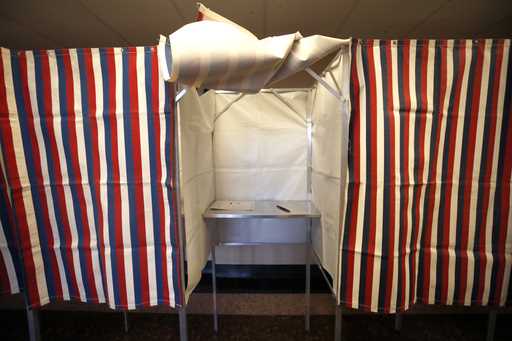 A booth is ready for a voter, February 24, 2020, at City Hall in Cambridge, Mass