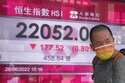Asian shares mixed after wobbly day on Wall Street