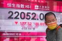 Asian shares mostly higher after wobbly day on Wall Street