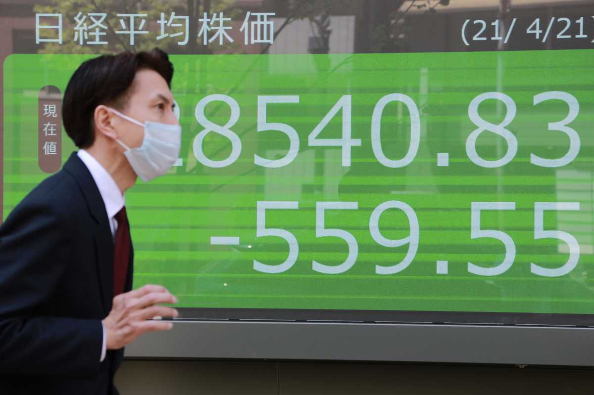 Asian shares slide after tech, bank selloff on Wall Street