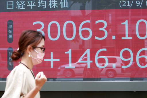 Asian stocks mostly lower after mixed day on Wall Street