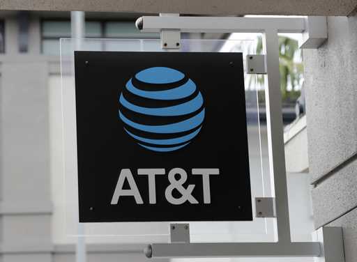The sign in front of an AT&T retail store is seen in Miami, July 18, 2019