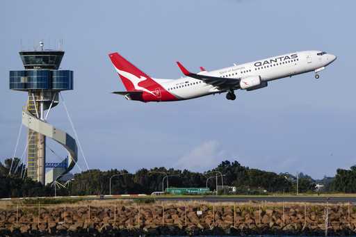 A Qantas Boeing 737 passenger plane takes off from Sydney Airport, Australia, on Sept
