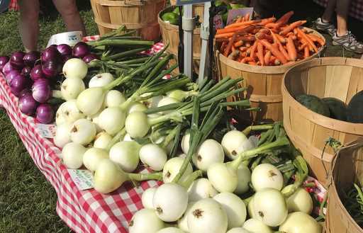 Various vegetables are displayed for sale at a farmer's market in Waitsfield, Vt