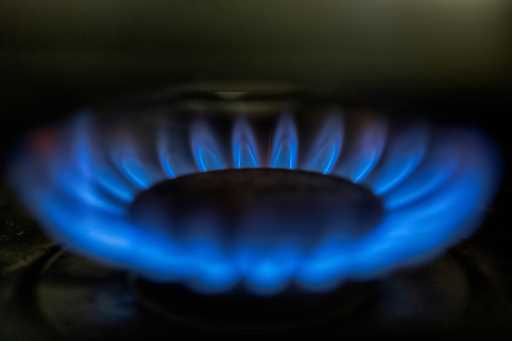 A gas-lit flame burns on a natural gas stove on Tuesday, March 26, 2024
