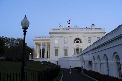 The White House is seen as dusk falls, Sunday, April 14, 2024, in Washington