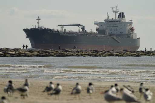 An oil tanker passes along a channel, March 2, 2022, in Port Aransas, Texas