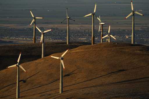 Wind turbines work in Livermore, Calif