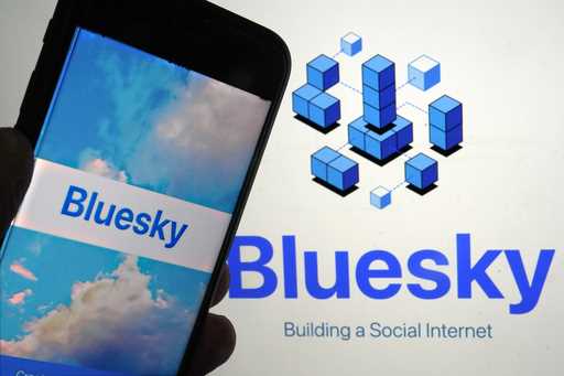 The app for Bluesky is shown on a mobile phone, left, and on a laptop screen, Friday, June 2, 2023,…