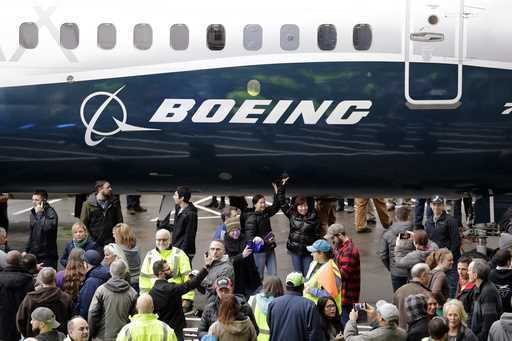 FILE- A Boeing 737 MAX 7 is displayed during a debut for employees and media on February 5, 2018, i…