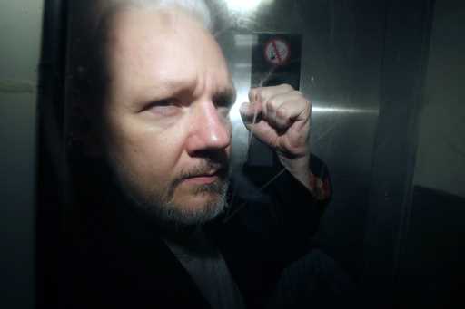 WikiLeaks founder Julian Assange being taken from court, where he appeared on charges of jumping Br…