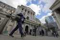 A man walks past the Bank of England, at the financial district in London, on May 11, 2023