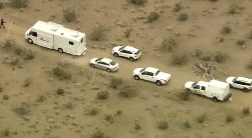 This aerial still image from video provided by KTLA shows law enforcement vehicles where several pe…