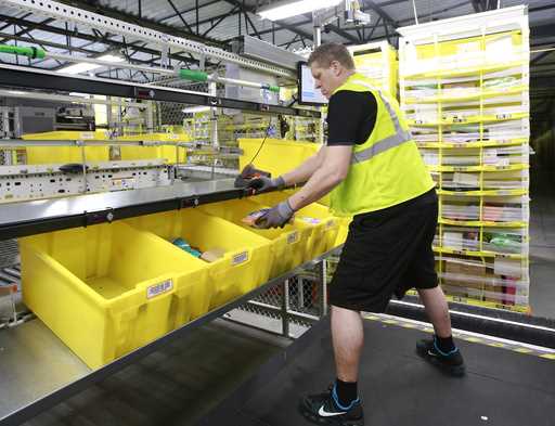 Merchandise is scanned to be tracked as it moves through the new Amazon Fulfillment Center in Sacra…