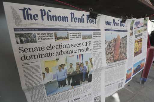Local newspapers the Phnom Penh Post, left, and Khmer Times, right, are for sale at a newspaper's s…