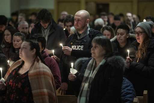 Community members gather and hold a vigil for the six people killed in a plane crash, in Fort Smith…