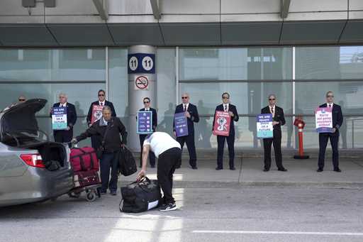 WestJet Airlines pilots stand on a picket line at Toronto's Pearson Airport on Monday May 8, 2023