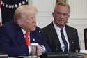 President Donald Trump, left, speaks as Health and Human Services Secretary Robert F