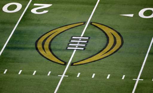 The College Football Playoff logo is shown on the field at AT&T Stadium before the Rose Bowl NCAA c…