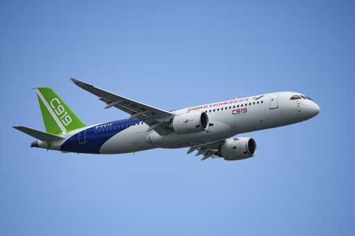 A China's Comac C919 aircraft performs during first day of Singapore Airshow in Singapore, Tuesday,…