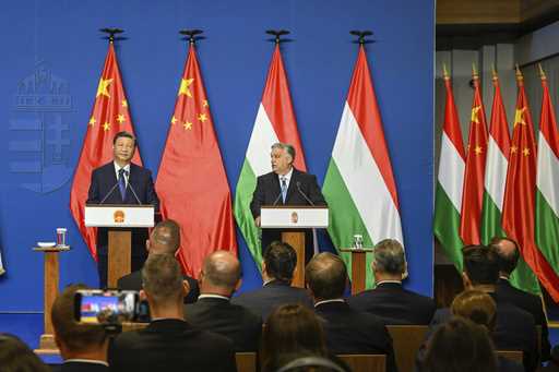 Chinese President Xi Jinping, left, listens during his joint press conference with Hungarian Prime …