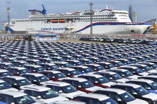 New cars wait to be transported on a dockyard in Yantai in eastern China's Shandong province on Sun…