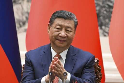 Chinese President Xi Jinping applauds during a signing ceremony at the Great Hall of the People in …