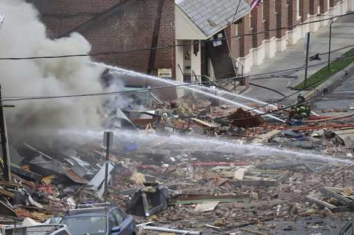 Emergency personnel work at the site of a deadly explosion at a chocolate factory in West Reading, …