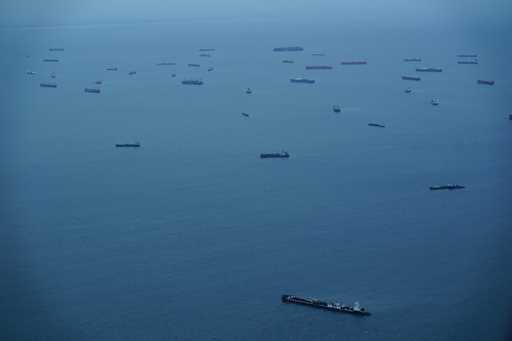 Cargo ships wait in Panama Bay before moving through the Panama Canal in Panama City, Sept