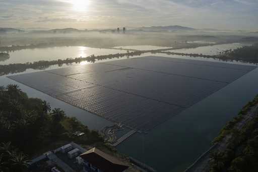 The sun rises over floating solar panels on May 3, 2023, in Selangor, Malaysia