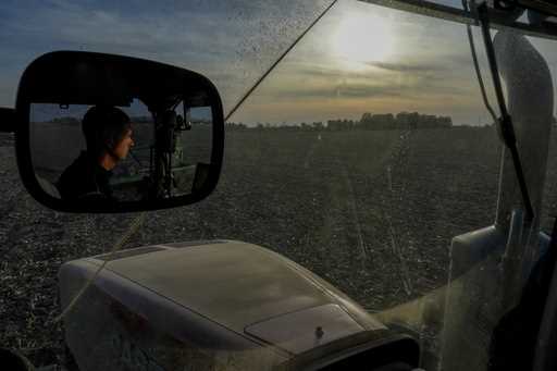 Mark Woodruff operates a planter in a soybean field, Monday, April 22, 2024, in Sabina, Ohio