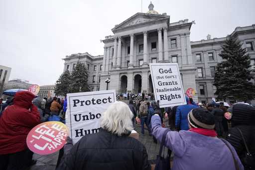 Attendees protest the one-year anniversary of Colorado's abortion law, the Reproductive Health Equi…