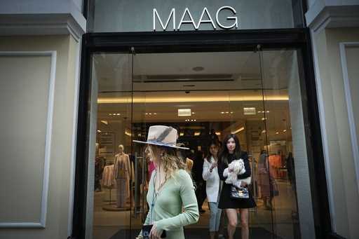 A woman exits a newly opened Maag store, a former Zara flagship store, in Moscow, Russia, Thursday,…