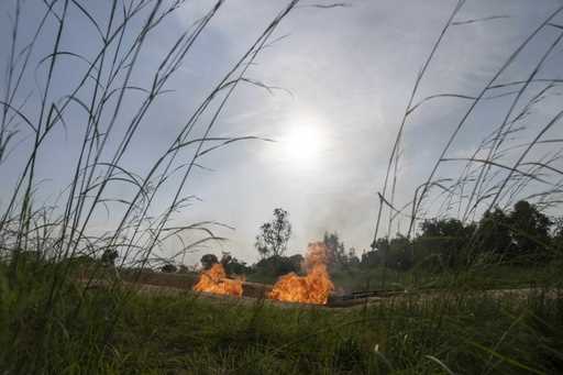 A burning flare is visible at an oil extraction area located in Moanda, Democratic Republic of the …