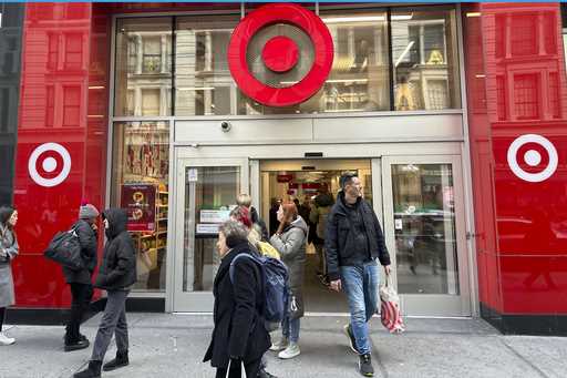 Shoppers walk from a Target store in midtown Manhattan in New York on Tuesday, March 19, 2024
