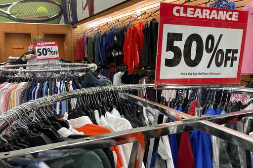 Clearance sale signs are displayed at a retail store in Downers Grove, Ill