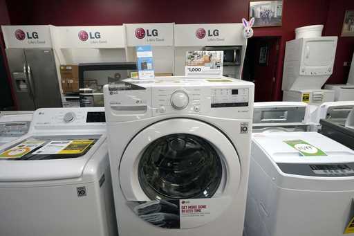 File - Washing machines are displayed at Sam's Appliances TV & Furniture, on March 25, 2021, in Nor…